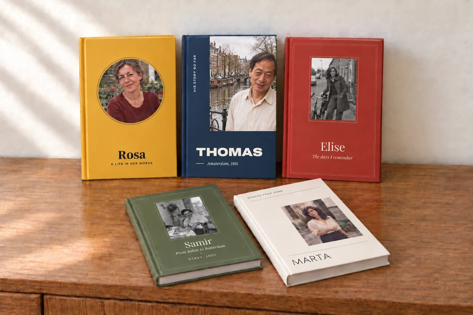 Five Told books with different covers and portraits: Rosa, Thomas, Elise, Samir and Marta